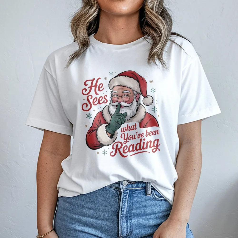 Humorous Book Lover Christmas Shirt, He Sees What You've Been Reading Shirt, Bookish Holiday Graphic Tee, Reader T-Shirt, Boo