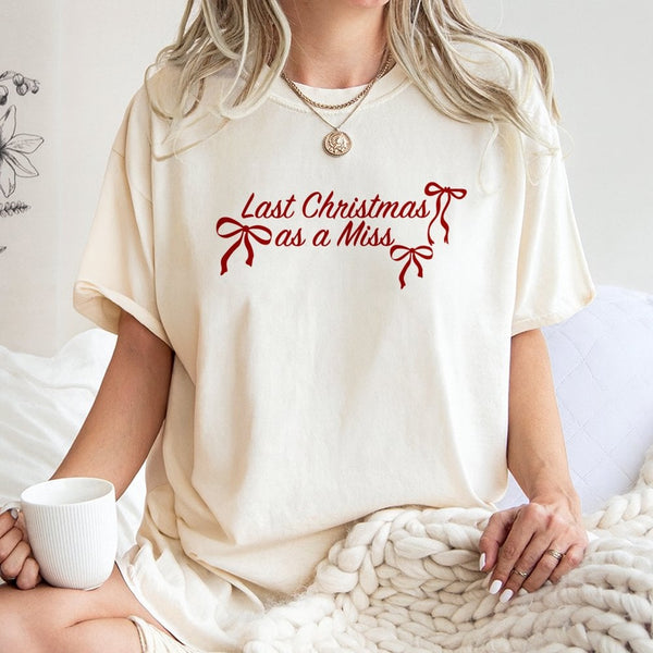 Festive Bow Typography Bride Tee, Last Christmas as A Miss T-Shirt, Holiday Engagement Graphic Shirt, Winter Bachelorette Pre