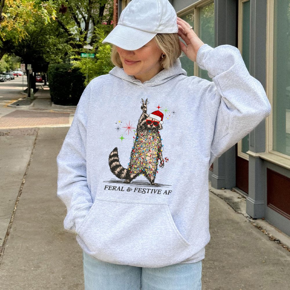 Tangled Christmas Lights Hoodie, Feral and Festive Raccoon Hoodie, Humorous Holiday Animal Pullover Hoodie, Retro Xmas Sweats