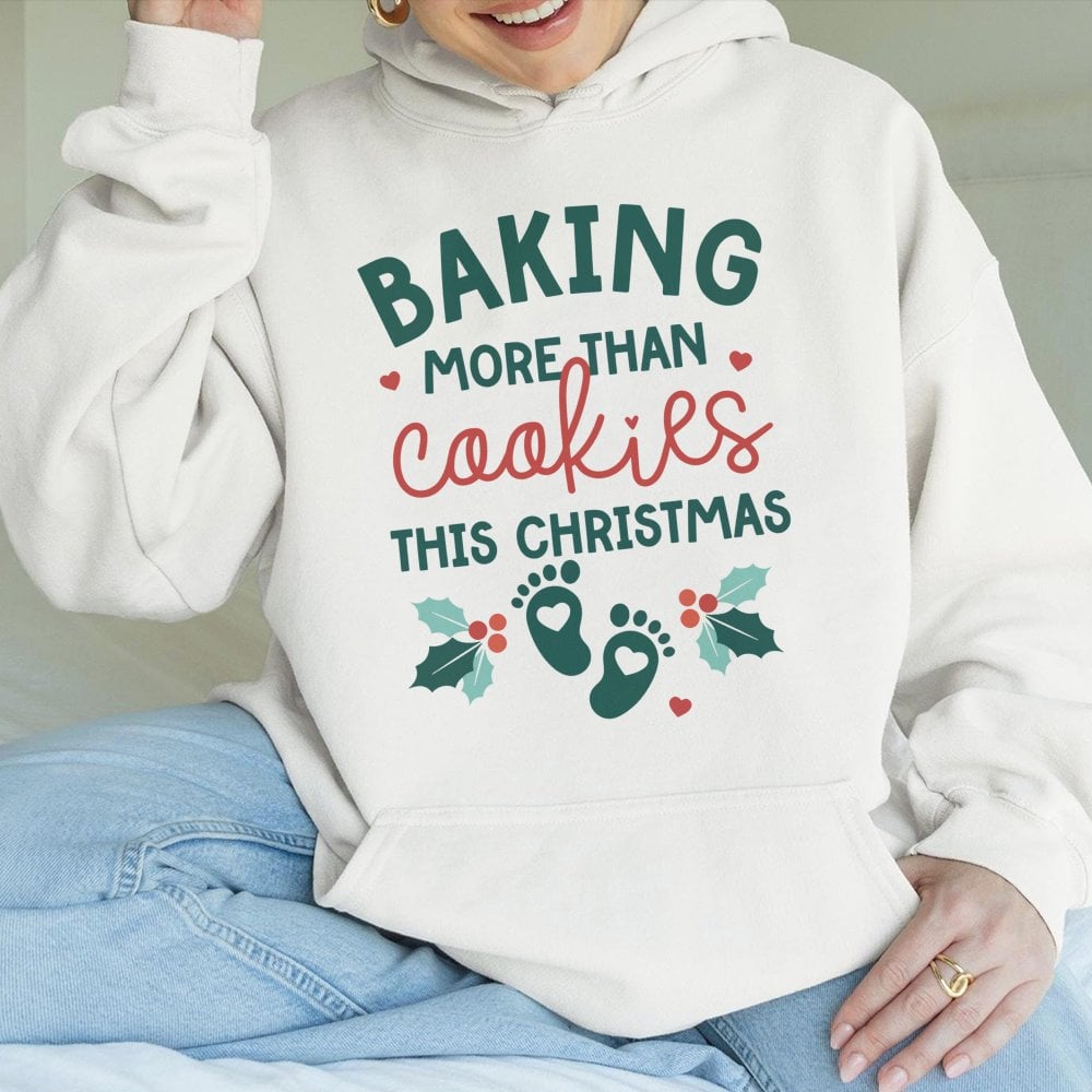 Humorous Pregnancy Reveal Sweatshirt, Baking More Than Cookies This Christmas Hoodie, Expecting Mom Holiday Pullover, Baby An