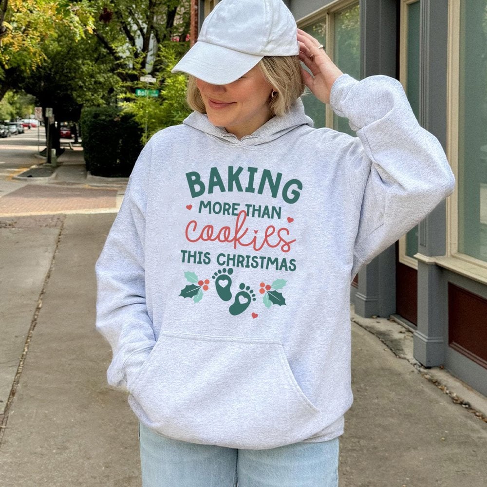 Humorous Pregnancy Reveal Sweatshirt, Baking More Than Cookies This Christmas Hoodie, Expecting Mom Holiday Pullover, Baby An