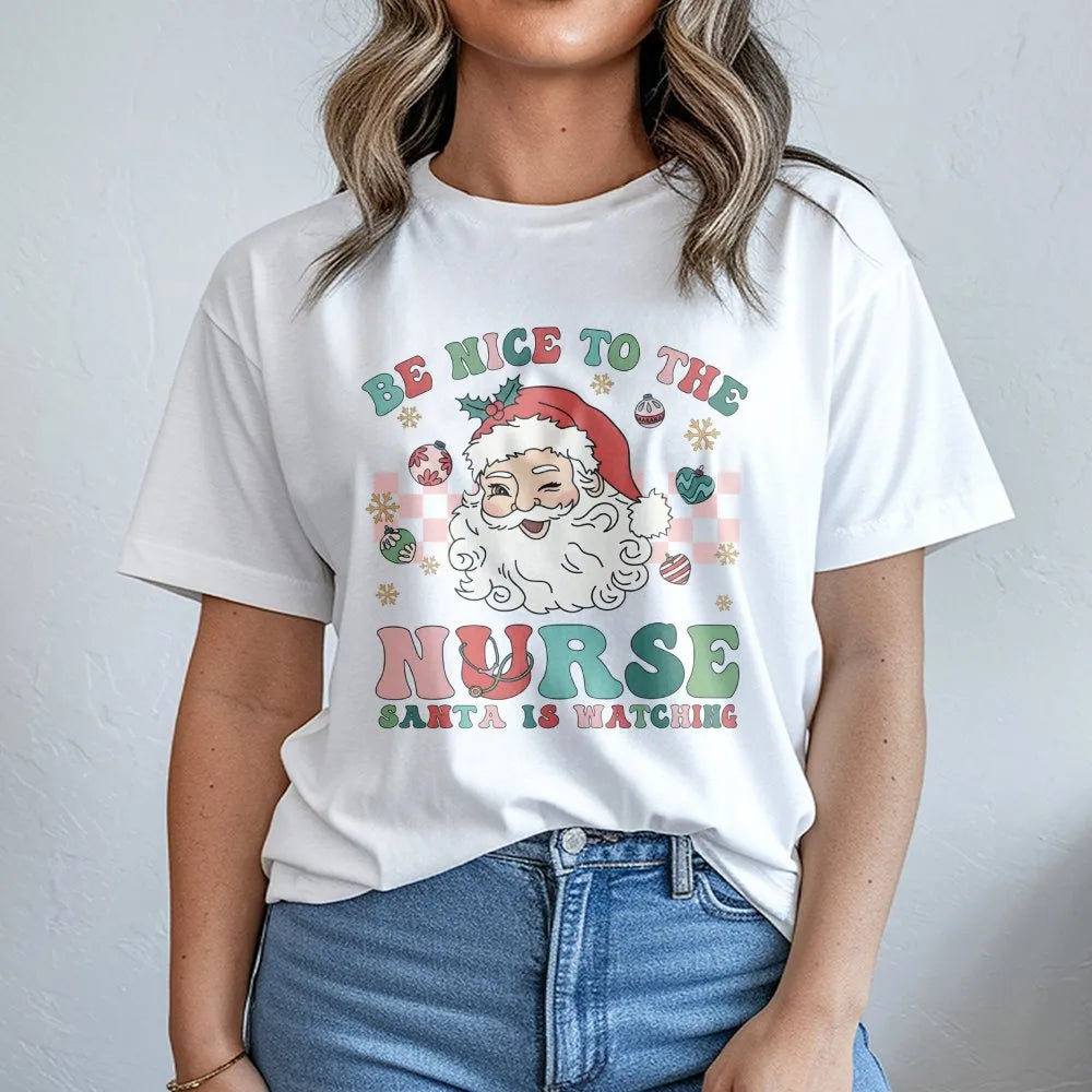 Humorous Nurse Christmas T-Shirt, Be Nice to the Nurse Santa Is Watching Shirt, RN Holiday Graphic Tee, Healthcare Xmas Shirt